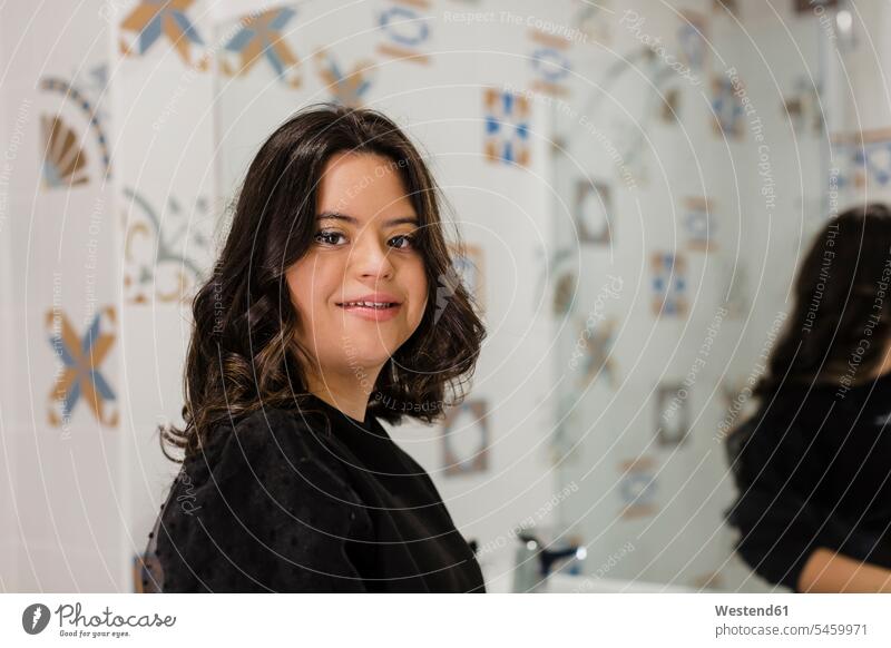 Confident young woman with down syndrome standing in bathroom at home caucasian caucasian appearance caucasian ethnicity european White - Caucasian caucasians