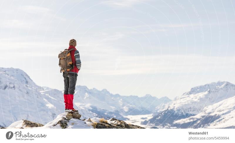 Switzerland, Engadin, hiker in mountainscape looking at view mountain range mountain ranges mountainscapes mountain scenery Mountainous Region hiking wanderers