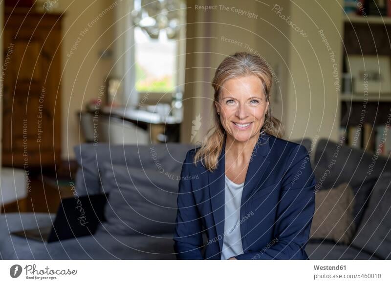 Portrait of smiling mature businesswoman at home human human being human beings humans person persons caucasian appearance caucasian ethnicity european 1