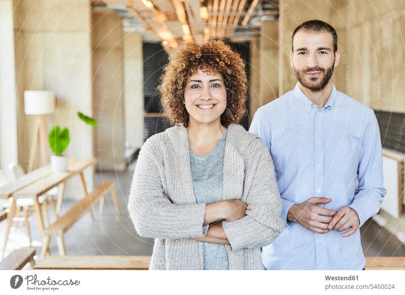 Portrait of smiling colleagues in modern office offices office room office rooms contemporary portrait portraits smile workplace work place place of work
