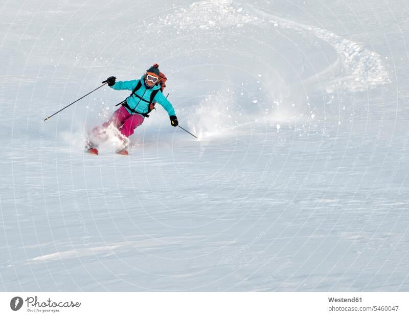 Switzerland, Grand Saint Bernard Pass, Pain de Sucre, Mont Fourchon, woman on a ski tour in the mountains riding downhill females women Downhill Skiing