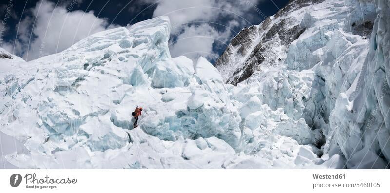 Nepal, Solo Khumbu, Everest, Sagamartha National Park, Mountaineer climbing in the ice Himalayas climber alpinists climbers mountaineer Mountain Climber