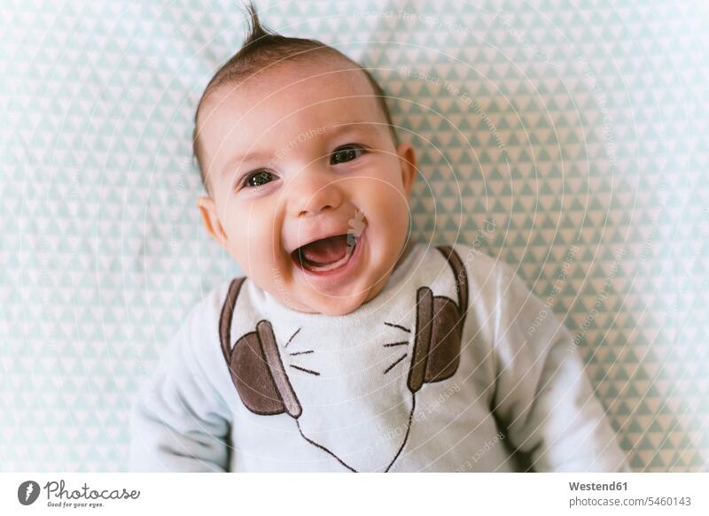 Portrait of laughing baby girl with appliqued headphones on pyjama human human being human beings humans person persons caucasian appearance caucasian ethnicity
