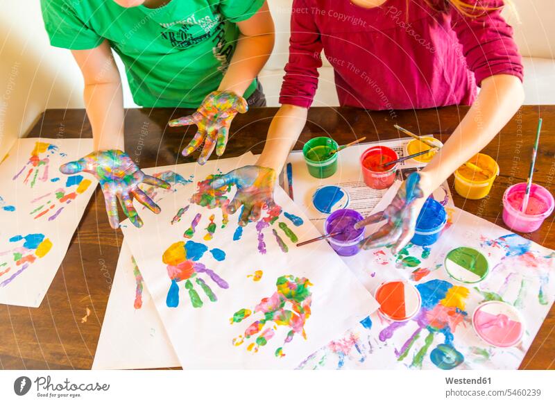 Girl and boy playing with finger paint, hand prints imprint imprints fingerpainting finger paints human hand hands human hands Hand Print Hand Prints Handprints