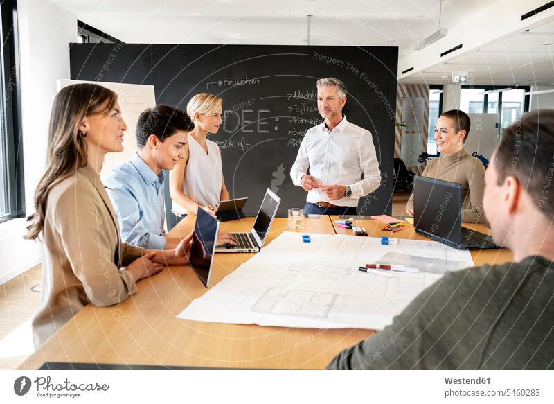 Business people having a workshop in office, discussing plans human human being human beings humans person persons caucasian appearance caucasian ethnicity