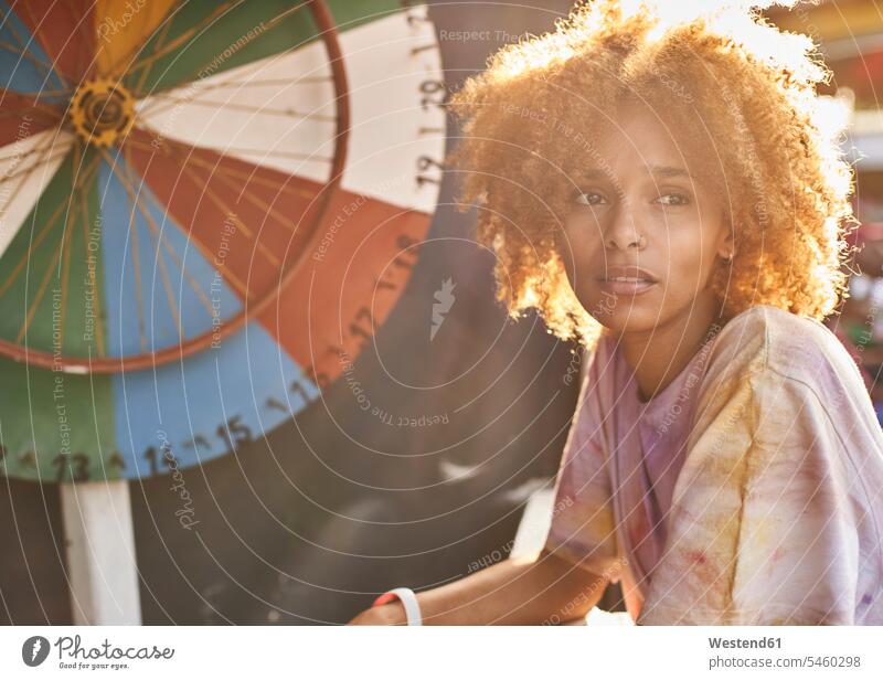 Woman at a wheel of fortune human human being human beings humans person persons African black black ethnicity coloured adult grown-up grown-ups grownup