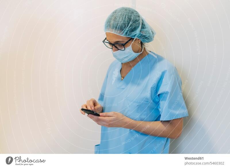Female doctor using smartphone in hospital, preparing for surgery occupation profession professional occupation jobs copy space Preparation prepare
