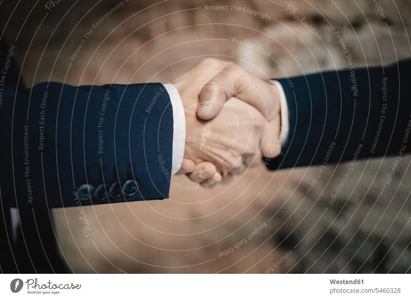 Close-up of two businessmen shaking hands human human being human beings humans person persons caucasian appearance caucasian ethnicity european 2 2 people