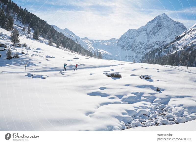 Austria, Tyrol, Luesens, Sellrain, two cross-country skiers in snow-covered landscape landscapes scenery terrain cross country skiing cross-country skiing