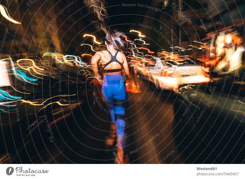 Woman running in the city at night human human being human beings humans person persons caucasian appearance caucasian ethnicity european 1 one person only