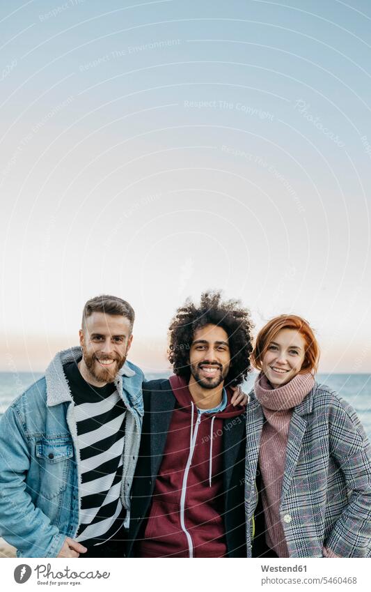 Portrait of three happy friends at the sea ocean portrait portraits happiness friendship water waters body of water togetherness style stylish lifestyle