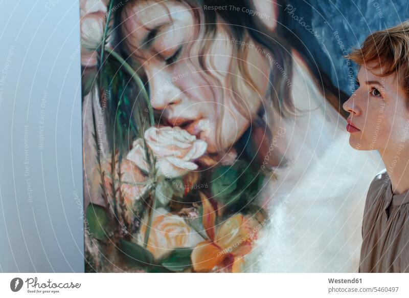 Thoughtful female artist by canvas painting in art studio color image colour image indoors indoor shot indoor shots interior interior view Interiors painter