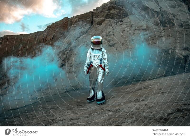 Spaceman exploring nameless planet, walking in a dust cloud astronaut astronauts unknown planets Exploration explore spaceman spacemen astronautics space travel