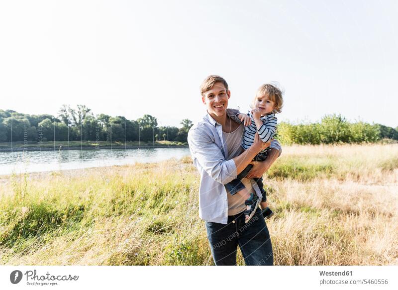 Father and son having fun at the river on a beautiful summer day caucasian caucasian ethnicity caucasian appearance european confidence confident River Rivers