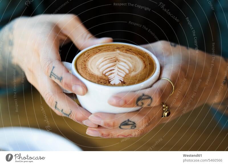 Tattooed hands holding cup of cappuchino jewelry Ring - Jewelry rings drink Distinct individual cafes cafeteria cafeterias coffee house coffee houses