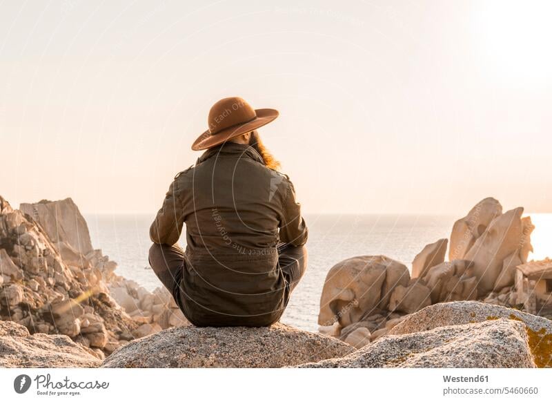 Italy, Sardinia, back view of man wearing hat looking at view men males View Vista Look-Out outlook seeing viewing hats Adults grown-ups grownups adult people