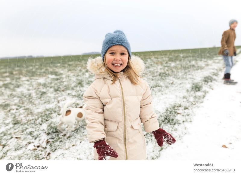 Portrait of happy girl with dog and brother in winter landscape hibernal winter landscapes dogs Canine happiness brothers females girls portrait portraits