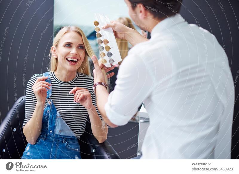 Hairdresser and happy woman at hair salon hair salons hairdresser hair-dresser hair-dressers hairdressers haircutter haircutters females women happiness