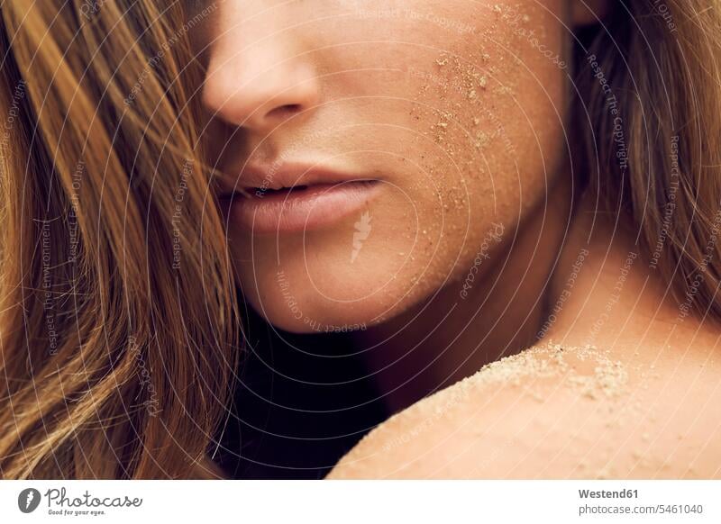 Woman with sand on her cheek, close-up woman females women sandy Adults grown-ups grownups adult people persons human being humans human beings model models