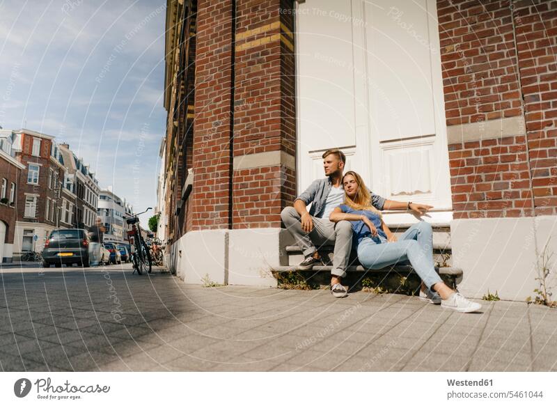 Netherlands, Maastricht, young couple having a break in the city twosomes partnership couples town cities towns people persons human being humans human beings