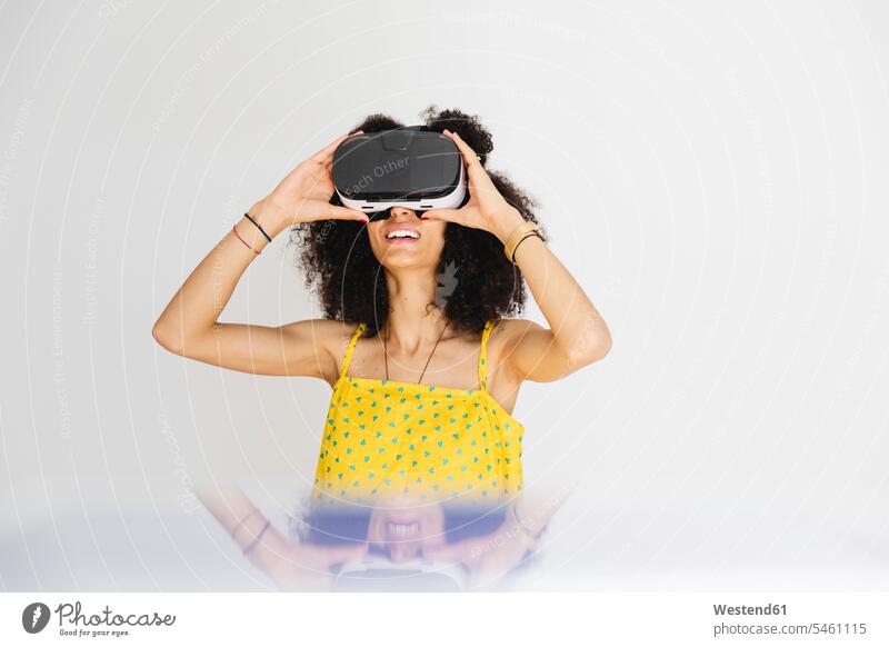 Young woman wearing virtual reality glasses human human being human beings humans person persons North African 1 one person only only one person adult grown-up