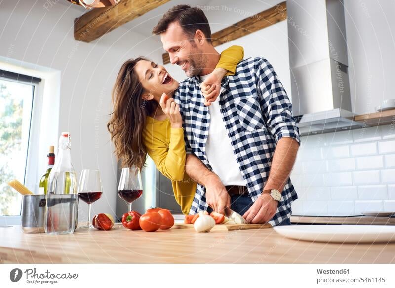 Affectionate couple in kitchen, preparing spaghetti toghether Spaghetti domestic kitchen kitchens together Food Preparation preparing food affectionate tender