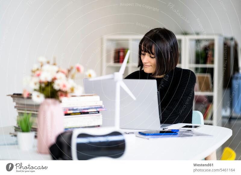 Young female student with concentration studying in study room color image colour image indoors indoor shot indoor shots interior interior view Interiors