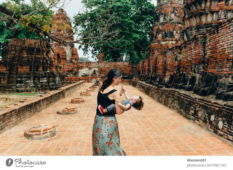 Thailand, Ayutthaya, Mother and daughter playing in the ancient ruins of a temple at Wat Mahathat mother mommy mothers ma mummy mama Old Ruin Ruins Old Ruins