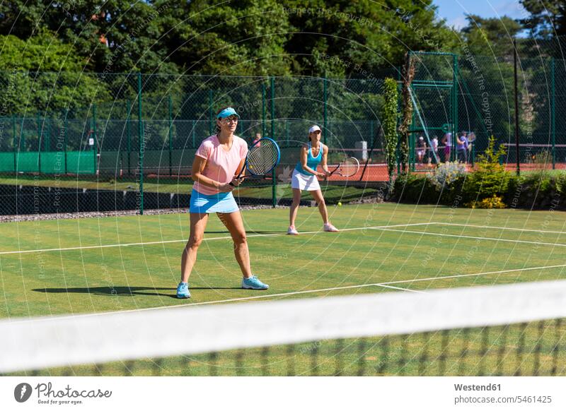 Mature women during a tennis match on grass court human human being human beings humans person persons caucasian appearance caucasian ethnicity european 2