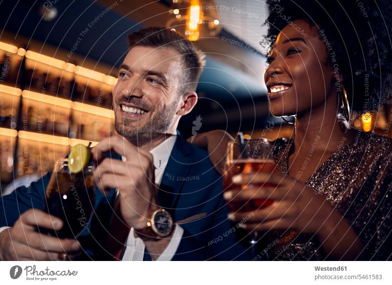 Happy couple socializing in a bar human human being human beings humans person persons caucasian appearance caucasian ethnicity european African black