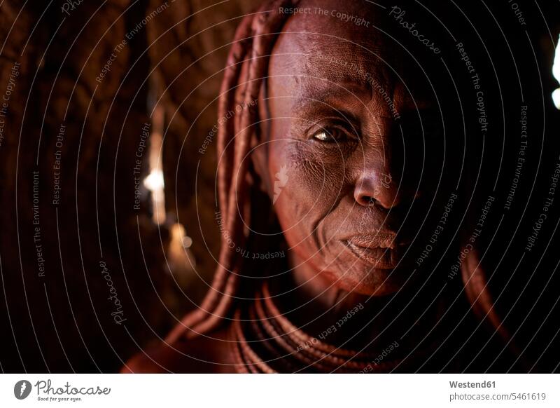 Portrait of an old Himba traditional woman, Oncocua, Angola Traditions Eye Contact looking at the camera looking to camera Head And Shoulder Head Shot