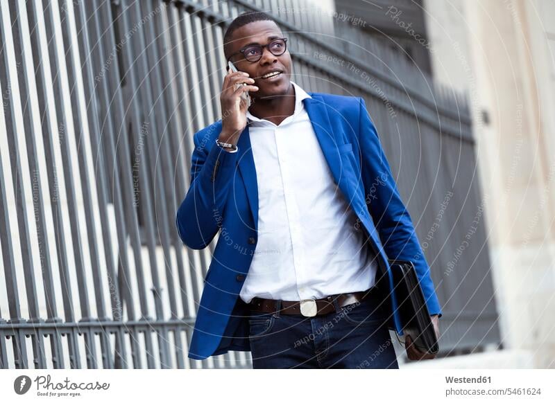 Young businessman wearing blue suit jacket and using smartphone business life business world business person businesspeople Business man Business men