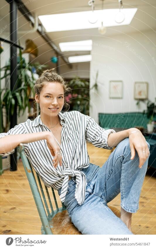 Young woman sitting relaxed on chair human human being human beings humans person persons caucasian appearance caucasian ethnicity european 1 one person only