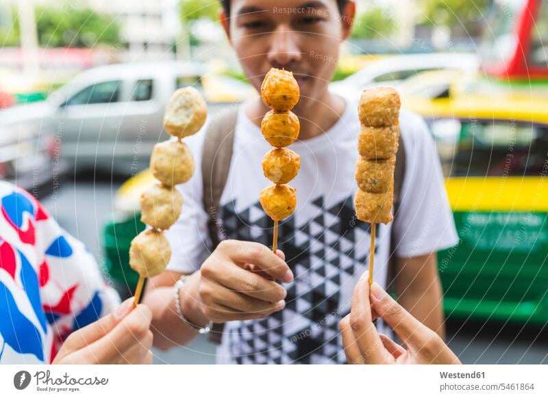 Thailand, Bangkok, group of friends eating street food, close-up Street Food friendship food and drink Nutrition Alimentation Food and Drinks typical typically