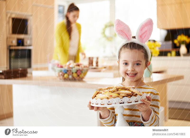 Portrait of smiling girl with bunny ears serving cookies Rabbit Ears Bunny Ear Bunny Ears costume rabbit ears smile Biscuit Cookie Cooky Cookies Biscuits serve
