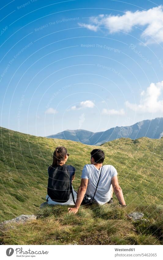 Bulgaria, Balkan Mountains, couple sitting on viewpoint, rear view View Vista Look-Out outlook Freedom Liberty free twosomes partnership couples