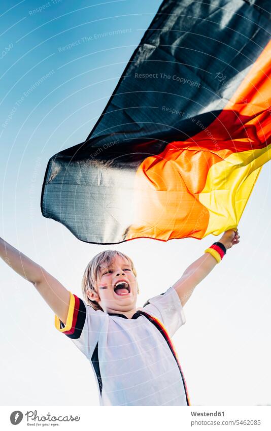 Boy, enthusiastic for soccer world championship, waving German flag football shirt football shirts soccer jerseys winning playing football fan soccer fans