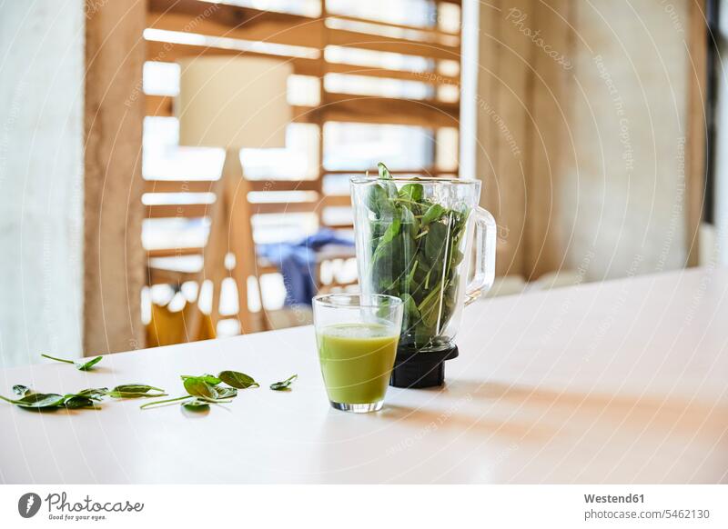 Green smoothie on table in office modern contemporary Smoothies Table Tables offices office room office rooms Drink beverages Drinks Beverage food and drink