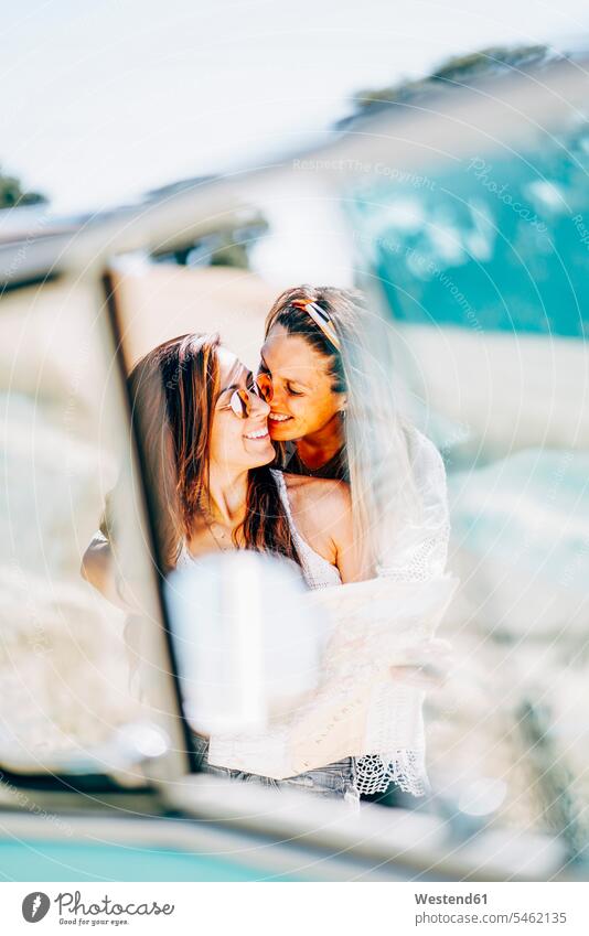 Lesbian couple doing a road trip, kissing and embracing in nature twosomes partnership couples Lesbian Couple Lesbians kisses summer summer time summery