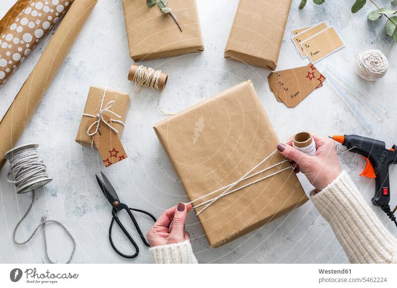 Hands of woman wrapping Christmas presents indoors indoor shot indoor shots interior interior view Interiors overhead view directly above top view Part Of