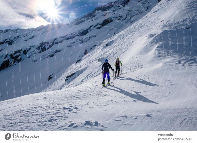 Two men doing a ski tour in Faragas mountains, Southern Carpathians, Romania Rumania Ski Touring ski tours skier skiers skiing Fagaras Mountains winter sport