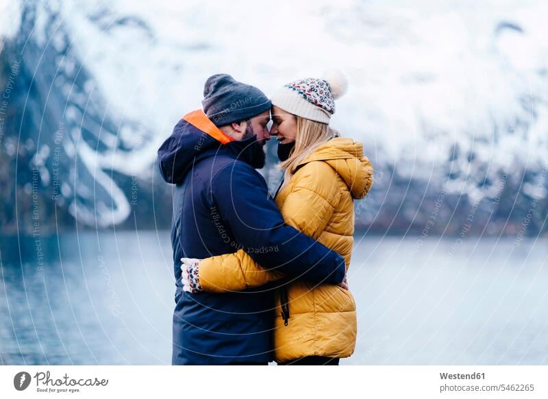 Affectionate tourist couple at Hamnoy, Lofoten, Norway human human being human beings humans person persons caucasian appearance caucasian ethnicity european 2