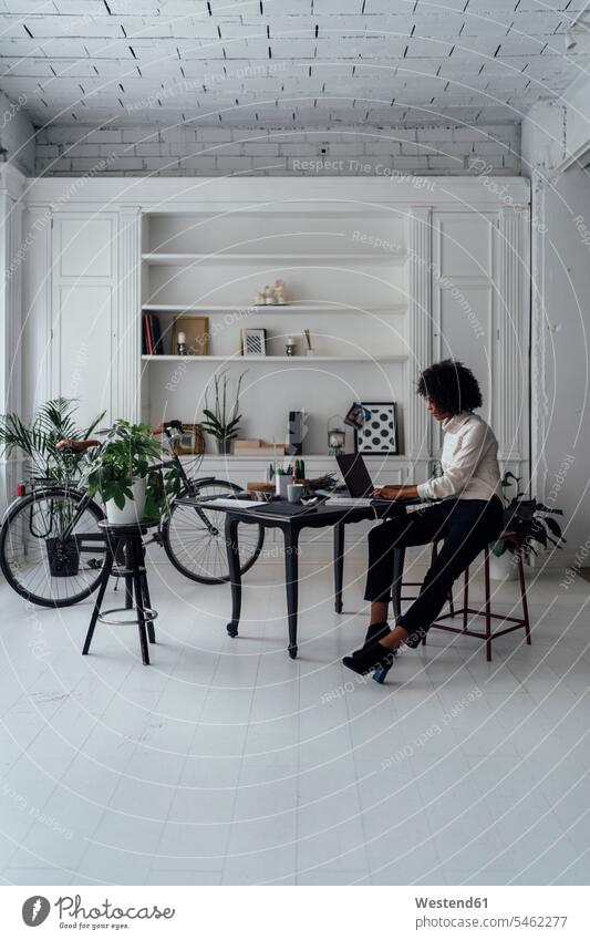 Mid adult woman working in her home office, using laptop freelancer freelancing mid adult women mid adult woman mid-adult women mid-adult woman At Work