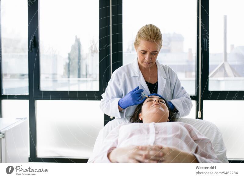 Woman receiving hyaluronic acid injection in medical practice human human being human beings humans person persons caucasian appearance caucasian ethnicity