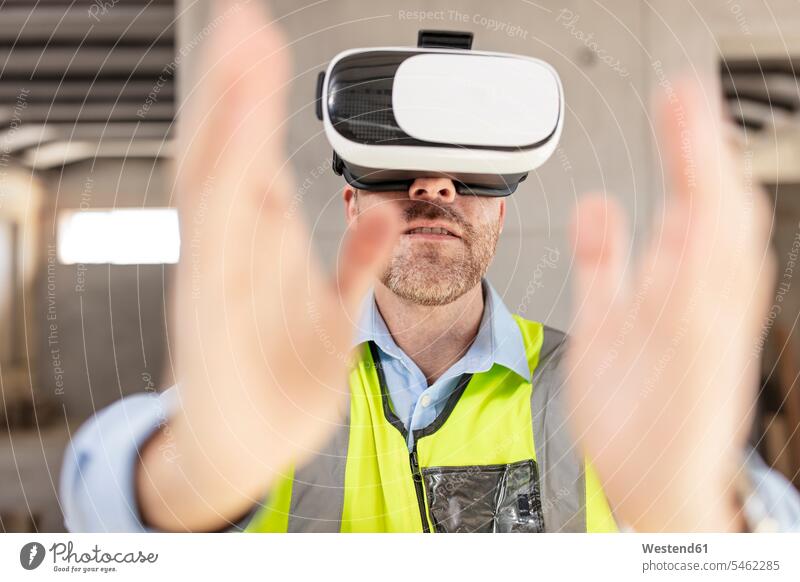 Architect with VR glasses at construction site human human being human beings humans person persons caucasian appearance caucasian ethnicity european 1