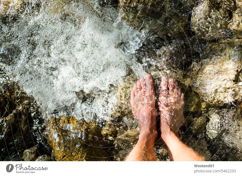 Man's feet standing on stone in a brook human human being human beings humans person persons caucasian appearance caucasian ethnicity european 1 one person only