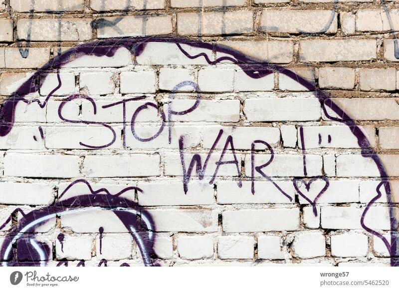 STOP WAR - graffito on a brick wall Stop War Graffito Current Wall (building) Exterior shot Colour photo Deserted spraying Characters Youth culture
