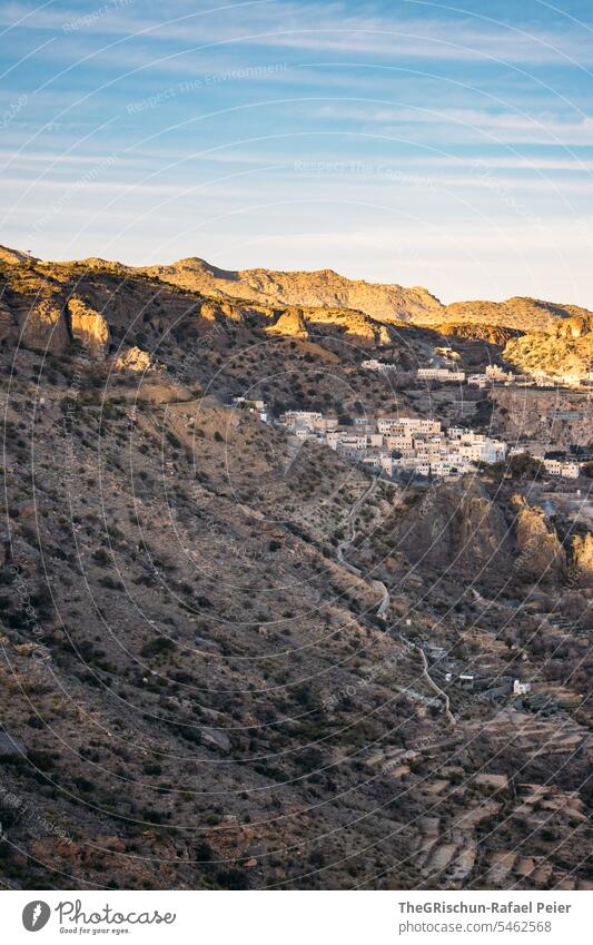 Small village surrounded by mountains at sunset Oman Steep hilly Sunset Moody Village Street Jebel Akhdar Dry Hot Nature Colour photo Sky Tourism Arabia Day