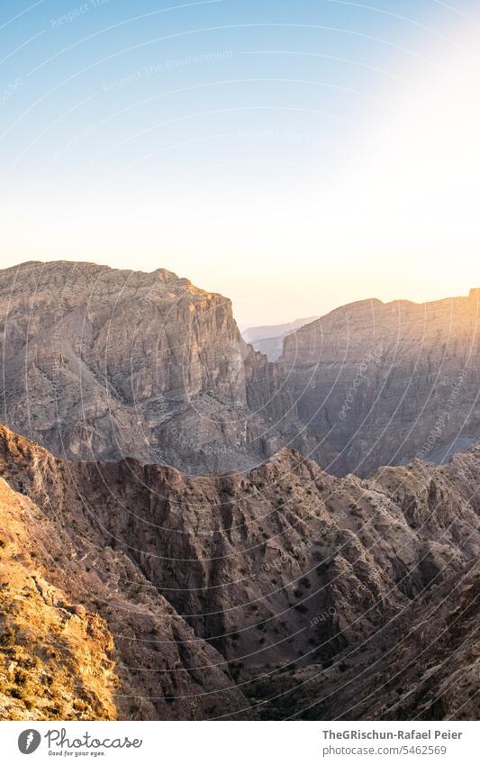 Sunset in the midst of mountains Oman Steep hilly Moody Jebel Akhdar Dry Hot Nature Colour photo Sky Tourism Arabia Day Mountain Back-light Sunlight sunset mood