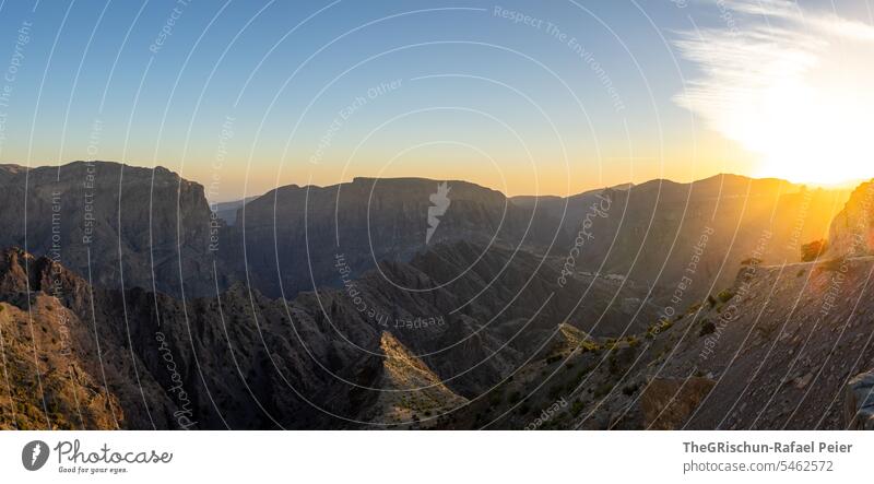 Panorama of sunset surrounded by mountains Oman Steep hilly Sunset Moody Jebel Akhdar Dry Hot Nature Colour photo Sky Tourism Arabia Day Mountain Back-light